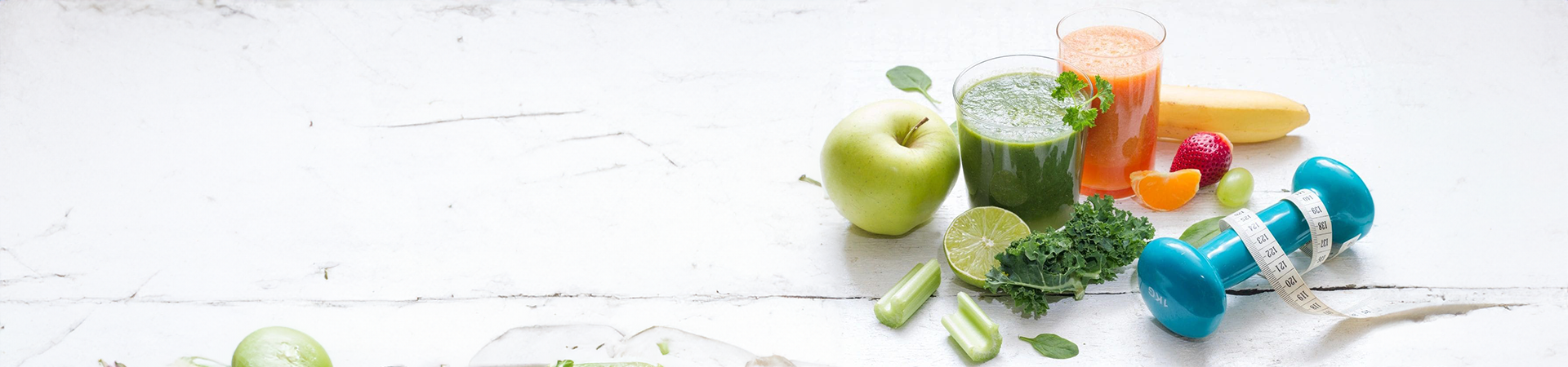 A table with green apples and limes on it