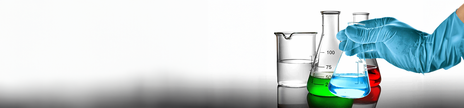 A glass beaker sitting on top of a table.